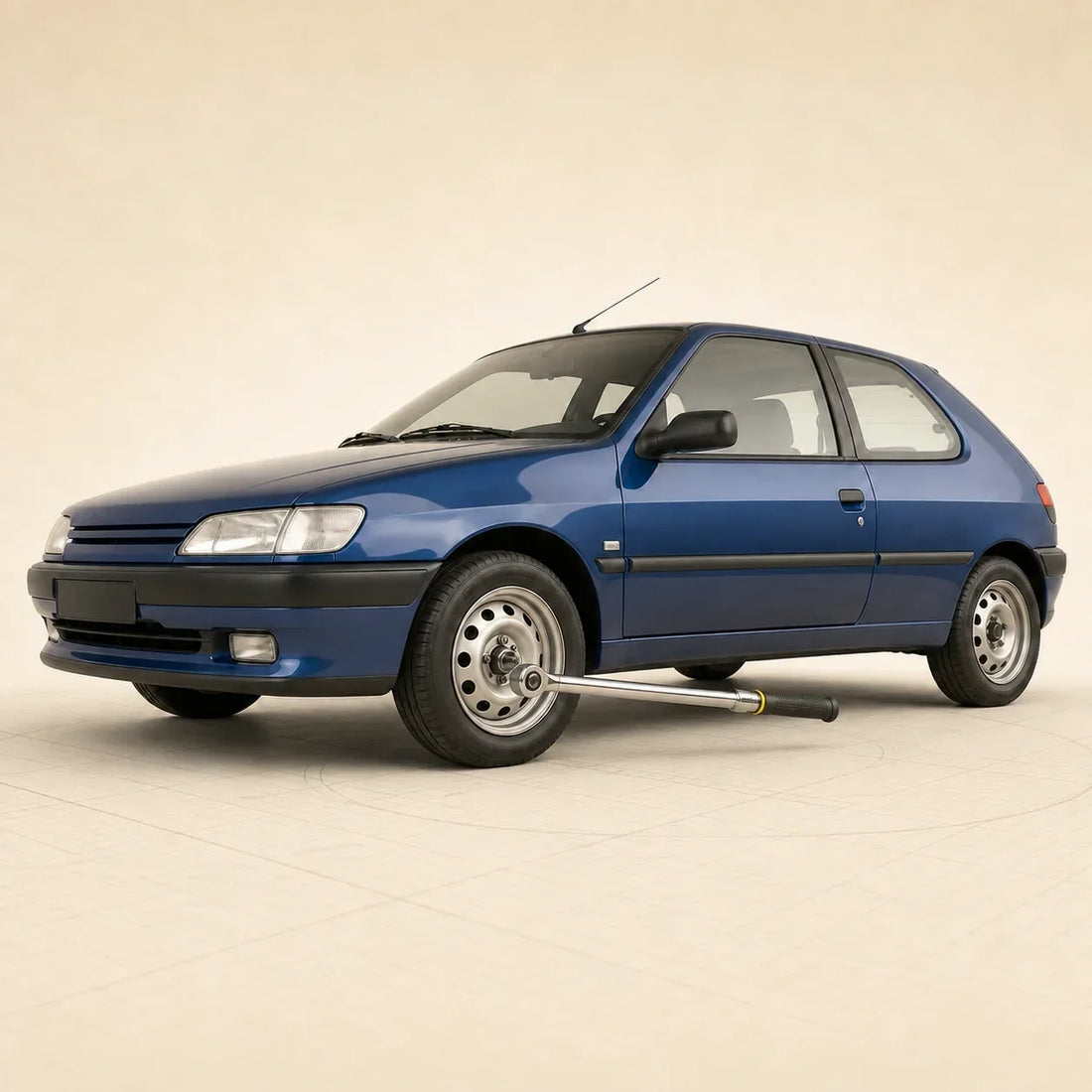 Peugeot 306 bleue avec une clé dynamométrique engagée sur une fixation de la roue avant